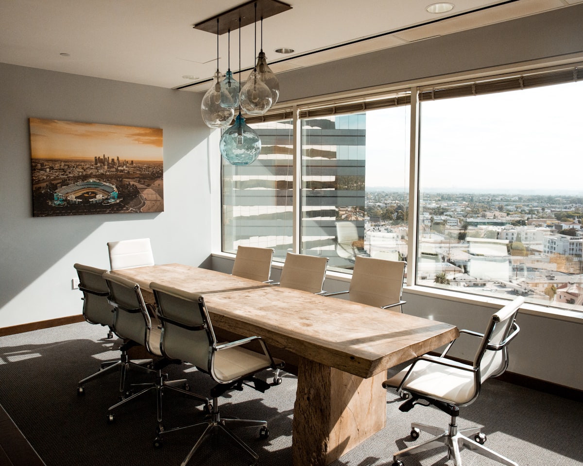 Meeting room with a long table and city view
